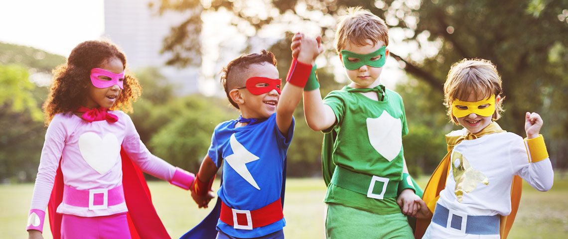Group of children dressed up in superhero outfits