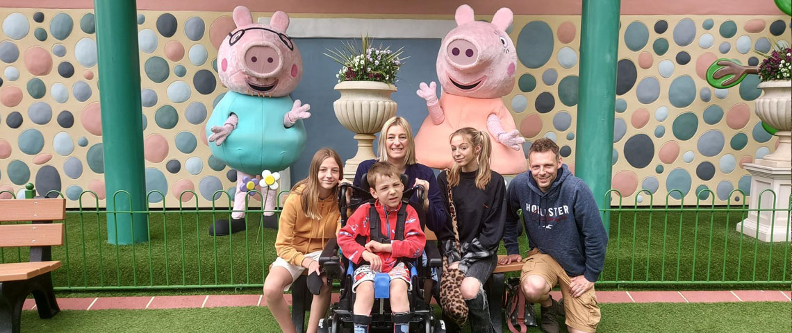 Jackson and his family at Peppa Pig World