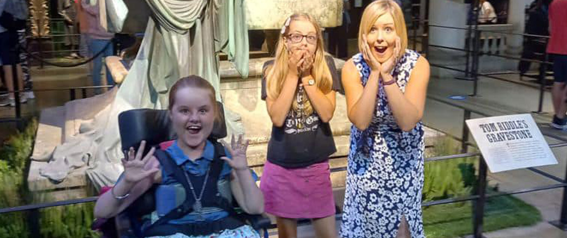 Molly and her family at Harry Potter World