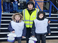Volunteers helping with bucket collection